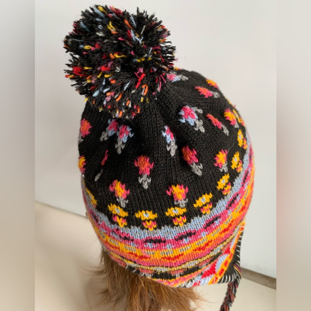 Festival Knit Hat with pom pom. Side Ties. Pink Yellow Black Floral pattern.